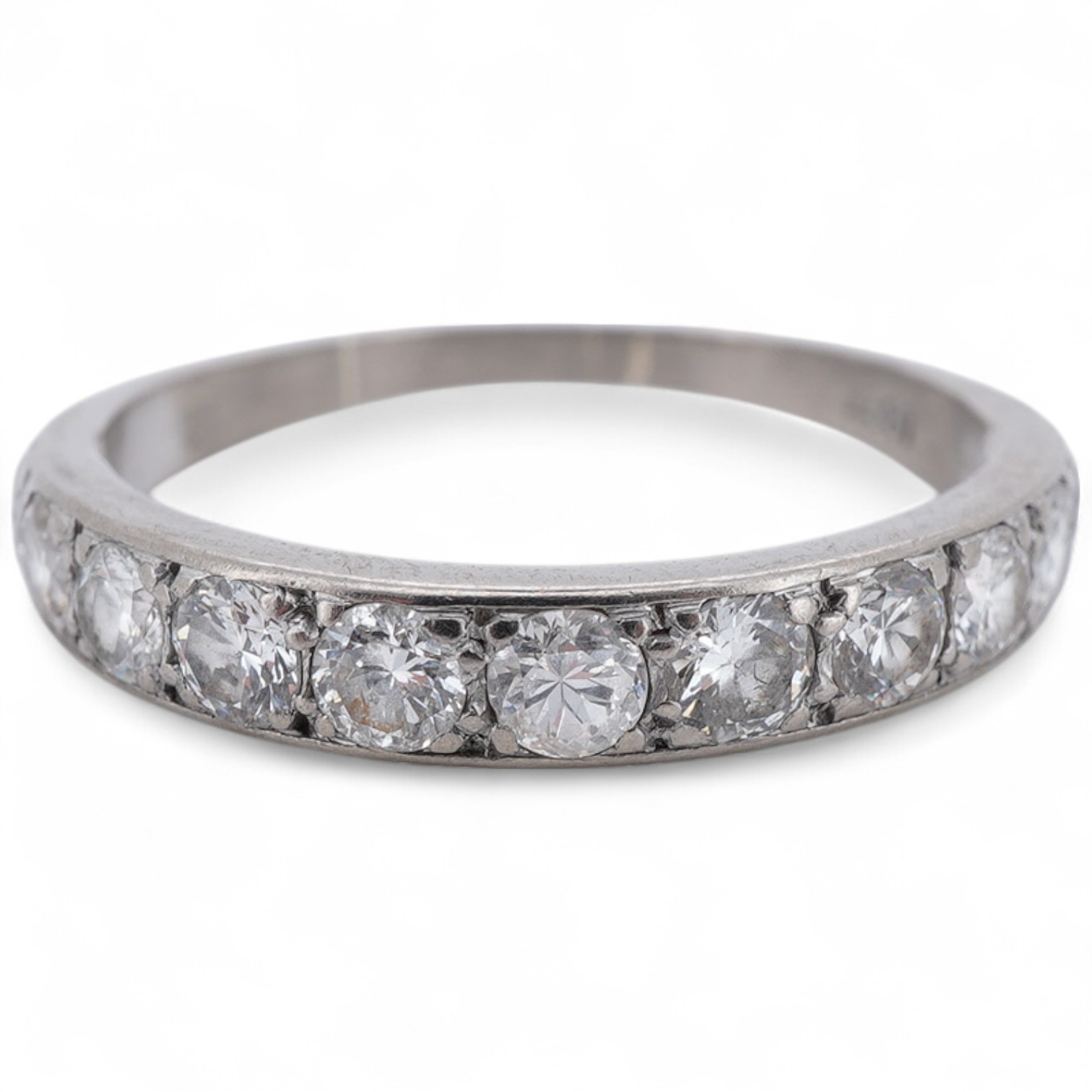 A diamond half eternity ring, set to the front with a sequence of brilliant-cut diamonds totalling approximately 0.80 carats, mounted in white gold, size O1/2, stamped 18CT, gross weight approximately 2.5 grams